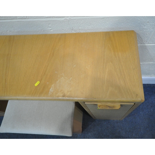 190 - A MODERN LIGHT OAK DESK, fitted with a three tier pull out section, and three drawers, width 166cm x... 