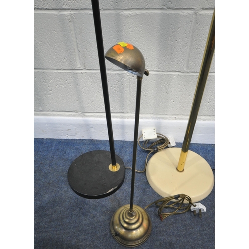 193 - TWO STANDARD LAMPS, along with a French brass table lamp, with an adjustable support and head, condi... 