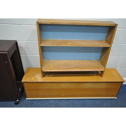 195 - A LARGE MAHOGANY EFFECT DROP LEAF TABLE, a long oak storage box, along with an open bookcase, condit... 