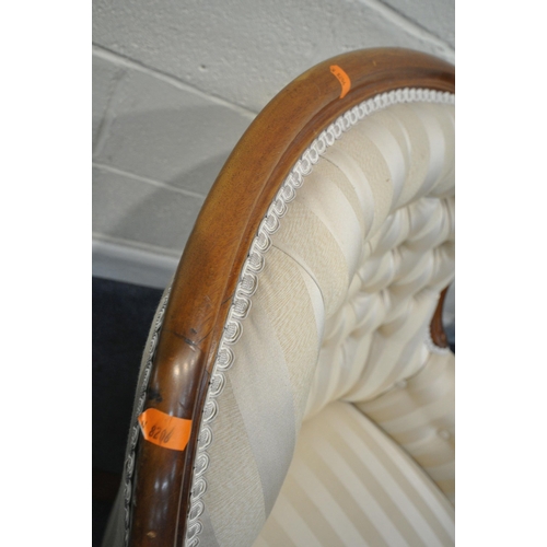 198 - A VICTORIAN HOOP BACK ARMCHAIR, with buttoned backrest, scrolled armrests, raised on shaped legs, an... 