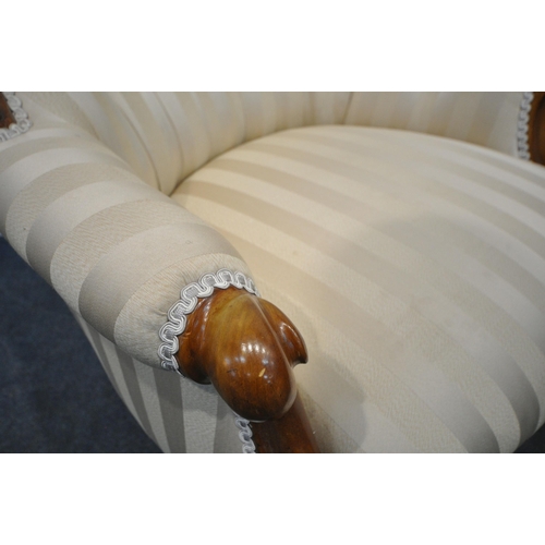 198 - A VICTORIAN HOOP BACK ARMCHAIR, with buttoned backrest, scrolled armrests, raised on shaped legs, an... 