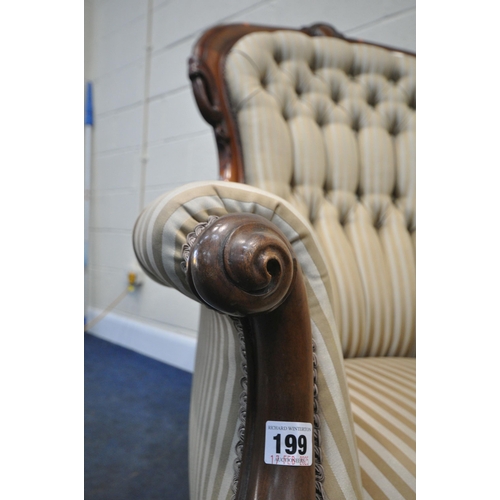 199 - A VICTORIAN ARMCHAIR, the hoop back with scrolled details and a shaped crest, scrolled armrests, rai... 