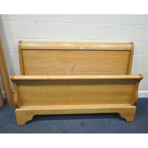 207 - A MODERN ASH 5FT SLEIGH BED, with side rails, slats and bolts, condition report: crack to headboard,... 