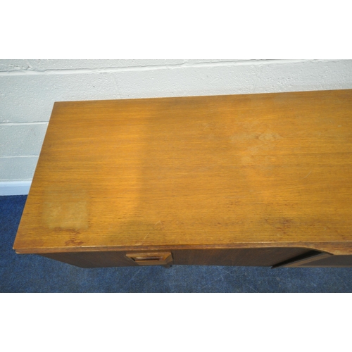 208 - A MID CENTURY TEAK SIDEBOARD, fitted with two bi-fold doors, flanking a central door, with articulat... 