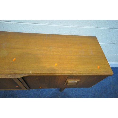 208 - A MID CENTURY TEAK SIDEBOARD, fitted with two bi-fold doors, flanking a central door, with articulat... 