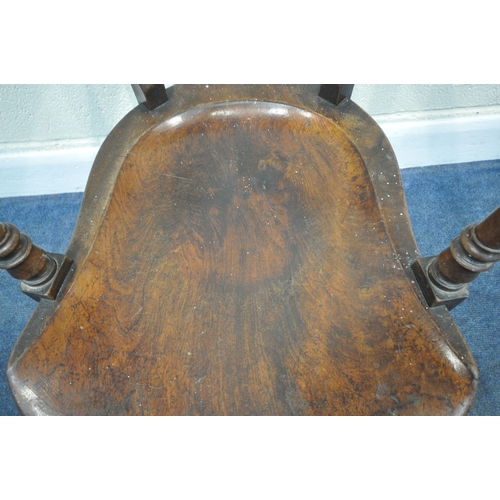 212 - A 19TH CENTURY WALNUT ARMCHAIR, with a deep dished seat, swept open armrests, raised on turned and t... 