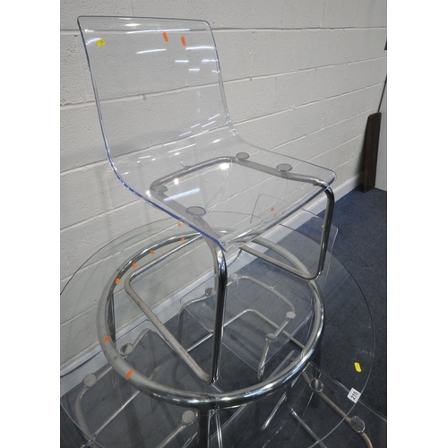 216 - AN IKEA SALMI CIRCULAR GLASS TOP TABLE, diameter 106cm x height 74cm, along with a set of four Ikea ... 