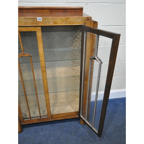 220 - A 20TH CENTURY WALNUT DISPLAY CABINET, with double glazed doors, enclosing two glass shelves, width ... 