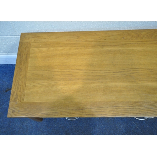 225 - A MODERN OAK COFFEE TABLE, fitted with two short over two long drawers, width 119cm x depth 57cm x h... 