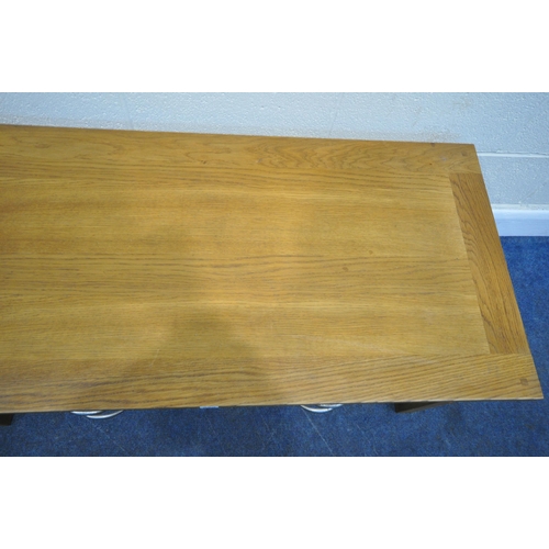 225 - A MODERN OAK COFFEE TABLE, fitted with two short over two long drawers, width 119cm x depth 57cm x h... 