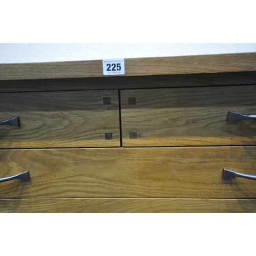 225 - A MODERN OAK COFFEE TABLE, fitted with two short over two long drawers, width 119cm x depth 57cm x h... 