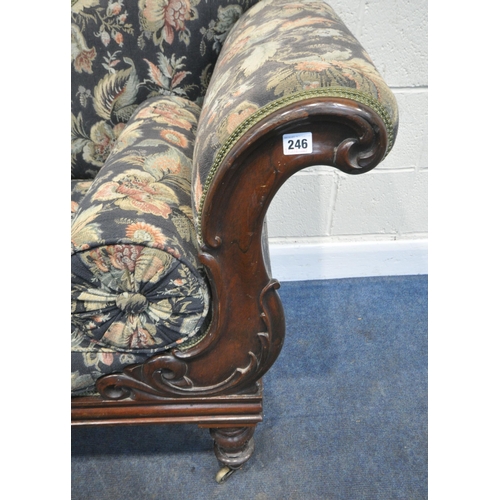 246 - A VICTORIAN ROSEWOOD CHAISE LOUNGE, with a shaped back and scrolled armrests, blue ground and foliat... 