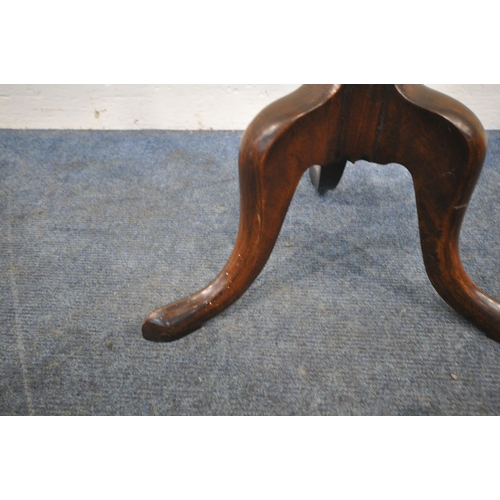 259 - AN EARLY 20TH CENTURY MAHOGANY PLANT STAND, with a wavy edge, cylindrical support, raised on three s... 