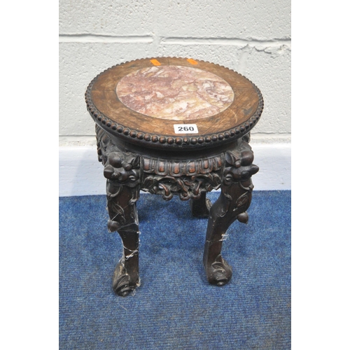 260 - A SMALL CHINESE HUANGHUALI TABLE, with a marble insert, and intricate carved details all over, diame... 