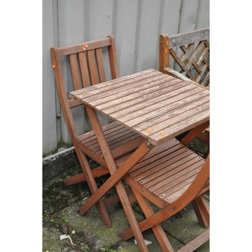 7 - A STAINED BEECH FOLDING GARDEN TABLE AND TWO CHAIRS, condition report: with fsc label, finish peelin... 