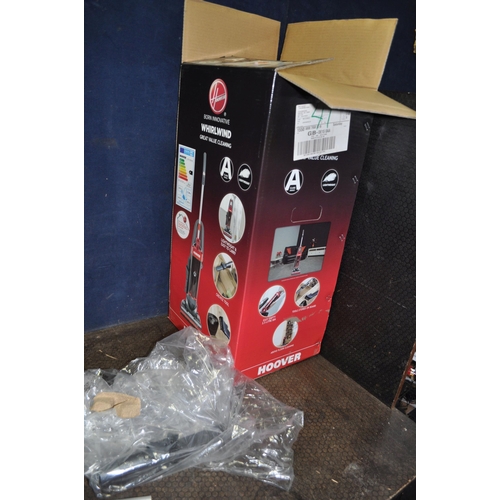 83 - A HOOVER WHIRLWIND UPRIGHT VACUUM CLEANER and a boxed and new Hoover Whirlwind vacuum chassis (no co... 