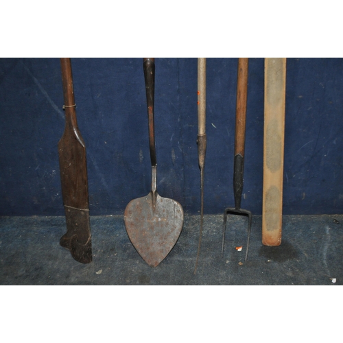 99 - A COLLECTION OF FOUR VINTAGE FARMING TOOLS  including a peat cutter, an oast shovel etc (4)