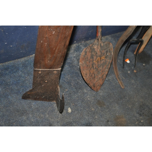 99 - A COLLECTION OF FOUR VINTAGE FARMING TOOLS  including a peat cutter, an oast shovel etc (4)