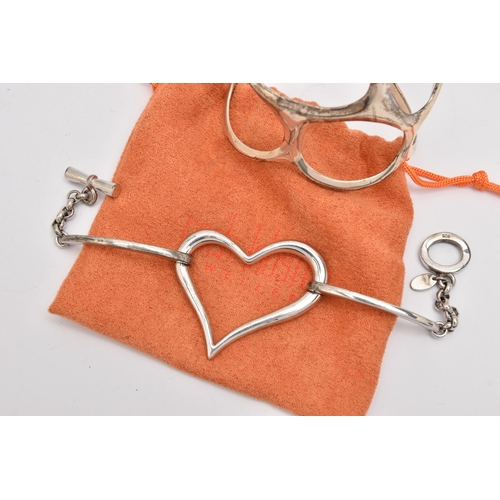 490 - A WHITE METAL BRACELET AND BANGLE, the first an open work heart bracelet, signed 'Fiorelli' stamped ... 