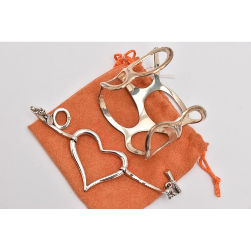 490 - A WHITE METAL BRACELET AND BANGLE, the first an open work heart bracelet, signed 'Fiorelli' stamped ... 