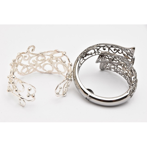 491 - TWO WHITE METAL BANGLES, the first a hinged open work cuff bangle set with cubic zirconia, signed 'B... 