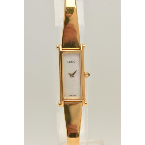 518 - A 'GUCCI' LADIES WRISTWATCH, quartz movement, rectangular mother of pearl dial, signed 'Gucci' gold ... 