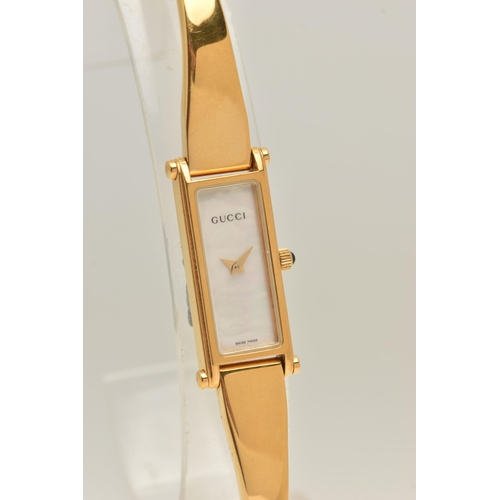 518 - A 'GUCCI' LADIES WRISTWATCH, quartz movement, rectangular mother of pearl dial, signed 'Gucci' gold ... 