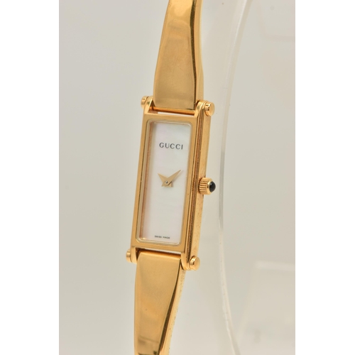 518 - A 'GUCCI' LADIES WRISTWATCH, quartz movement, rectangular mother of pearl dial, signed 'Gucci' gold ... 