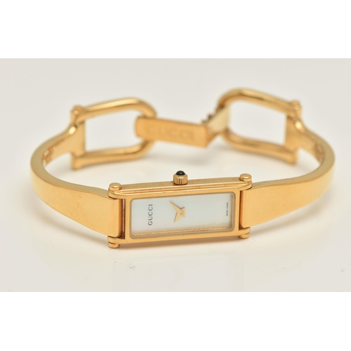 518 - A 'GUCCI' LADIES WRISTWATCH, quartz movement, rectangular mother of pearl dial, signed 'Gucci' gold ... 