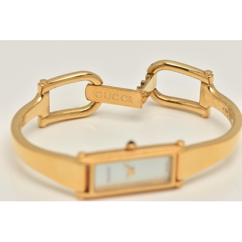 518 - A 'GUCCI' LADIES WRISTWATCH, quartz movement, rectangular mother of pearl dial, signed 'Gucci' gold ... 