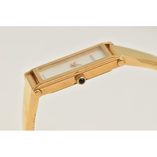 518 - A 'GUCCI' LADIES WRISTWATCH, quartz movement, rectangular mother of pearl dial, signed 'Gucci' gold ... 