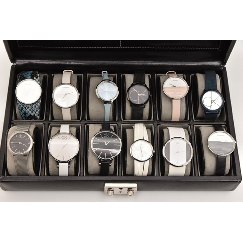 524 - A CASE OF 'CALVIN KLEIN' WRISTWATCHES, twelve ladies quartz movement wristwatches, all encased in in... 