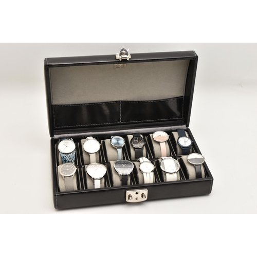 524 - A CASE OF 'CALVIN KLEIN' WRISTWATCHES, twelve ladies quartz movement wristwatches, all encased in in... 