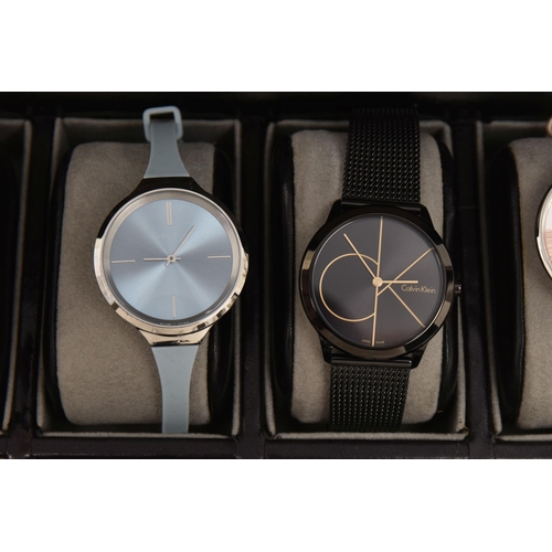 524 - A CASE OF 'CALVIN KLEIN' WRISTWATCHES, twelve ladies quartz movement wristwatches, all encased in in... 