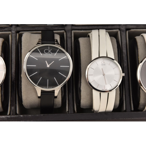 524 - A CASE OF 'CALVIN KLEIN' WRISTWATCHES, twelve ladies quartz movement wristwatches, all encased in in... 