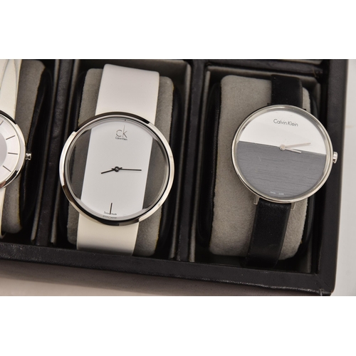 524 - A CASE OF 'CALVIN KLEIN' WRISTWATCHES, twelve ladies quartz movement wristwatches, all encased in in... 