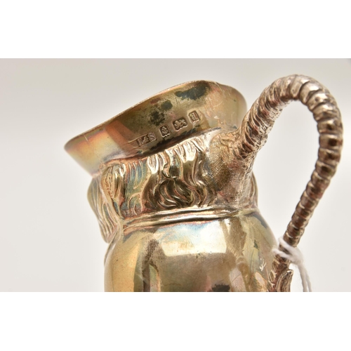 541 - A SILVER 'LEVI & SALAMAN' TOBY JUG, fitted with a scroll handle, height 8.5cm, hallmarked 'Levi & Sa... 