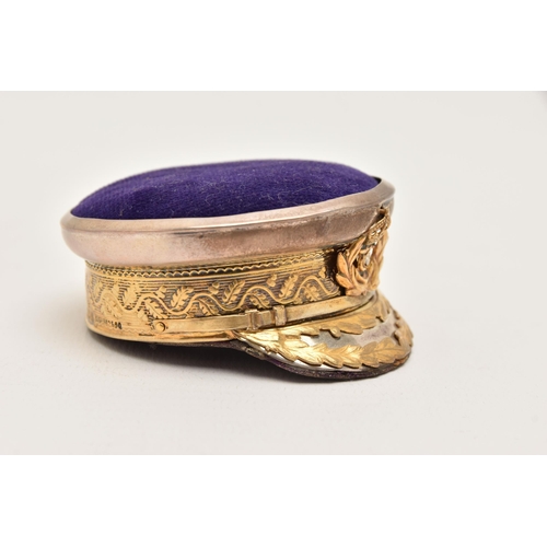 542 - AN EARLY 20TH CENTURY NOVELTY PIN CUSHION, in the form of a naval offices peak hat, gilt rim and cre... 