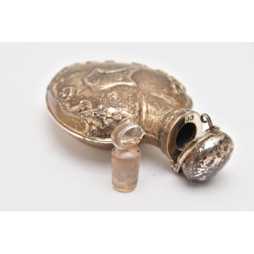 548 - AN EARLY 20TH CENTURY SILVER SCENT BOTTLE, in the form of a heart embossed with a cherub and floral ... 