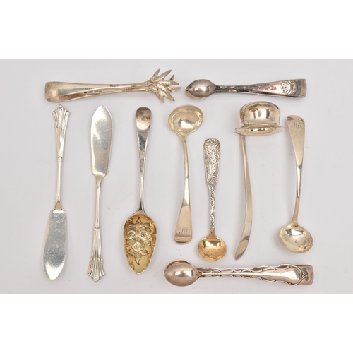 555 - AN ASSORTMENT OF SILVER CUTLERY PIECES, to include three pairs of sugar tongs, a small ladle, two ol... 