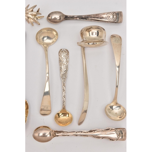 555 - AN ASSORTMENT OF SILVER CUTLERY PIECES, to include three pairs of sugar tongs, a small ladle, two ol... 