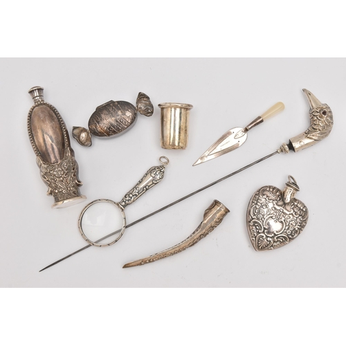 556 - A SMALL ASSORTMENT OF SILVER ITEMS, to include a silver scent bottle on a round base, screw cover, h... 