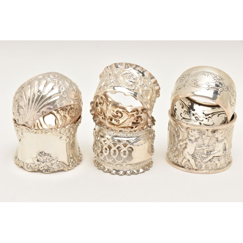 558 - SIX SILVER NAPKIN RINGS, various designs all with a full silver hallmarks, assay offices to include ... 