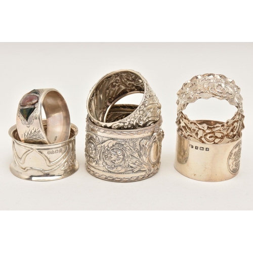 559 - SIX SILVER NAPKIN RINGS, various designs all with full silver hallmarks, assay offices to include Ch... 