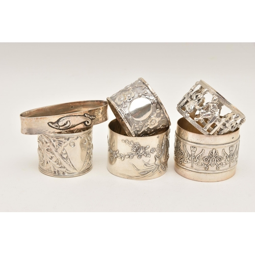 560 - ONE SILVER AND FIVE CONTINENTAL NAPKIN RINGS, to include a silver thistle detailed ring, hallmarked ... 