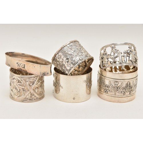 560 - ONE SILVER AND FIVE CONTINENTAL NAPKIN RINGS, to include a silver thistle detailed ring, hallmarked ... 