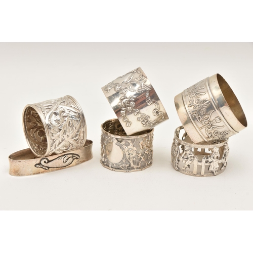 560 - ONE SILVER AND FIVE CONTINENTAL NAPKIN RINGS, to include a silver thistle detailed ring, hallmarked ... 