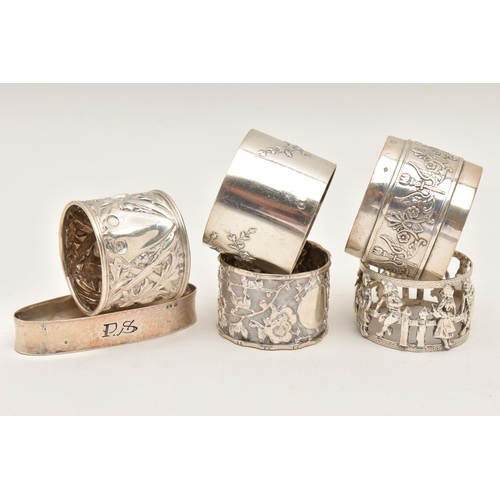 560 - ONE SILVER AND FIVE CONTINENTAL NAPKIN RINGS, to include a silver thistle detailed ring, hallmarked ... 