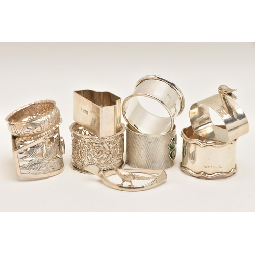 562 - NINE SILVER NAPKIN RINGS, of various designs, all with full silver hallmarks, assay offices to inclu... 