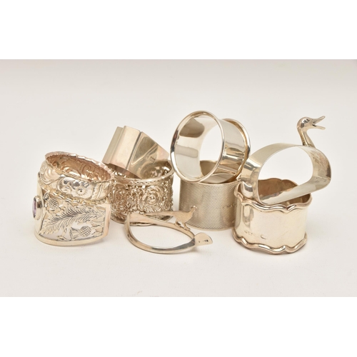 562 - NINE SILVER NAPKIN RINGS, of various designs, all with full silver hallmarks, assay offices to inclu... 